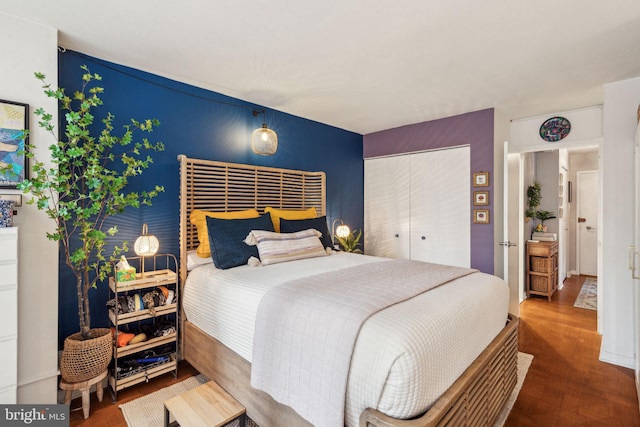 bedroom featuring hardwood / wood-style flooring and a closet