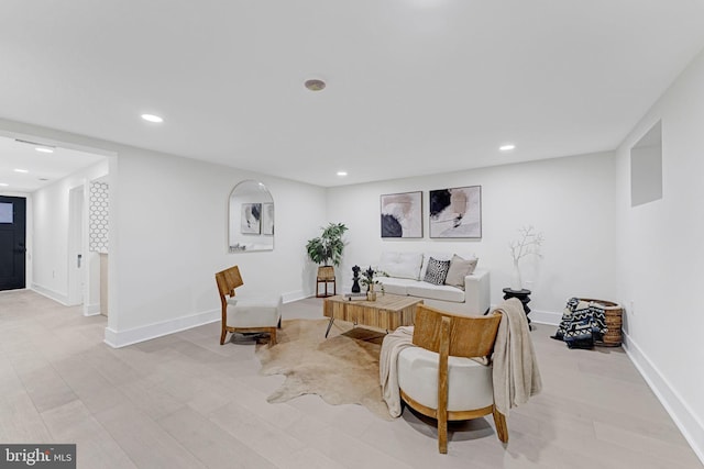 living room with light hardwood / wood-style flooring