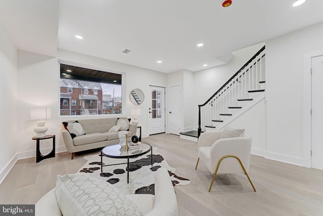 living room with light hardwood / wood-style floors