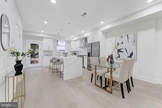 dining room featuring light hardwood / wood-style flooring