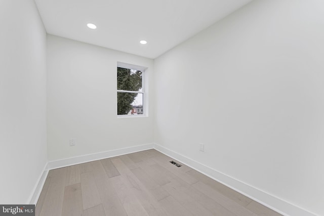 empty room with light hardwood / wood-style floors