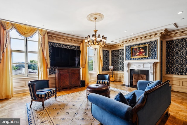 living room featuring light parquet floors, a healthy amount of sunlight, and crown molding