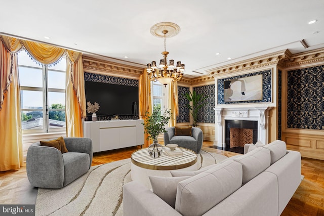 living room featuring a chandelier, parquet floors, and crown molding