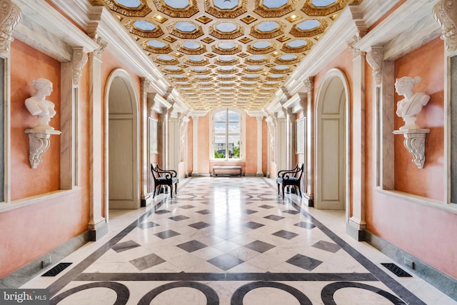 interior space featuring ornate columns and crown molding