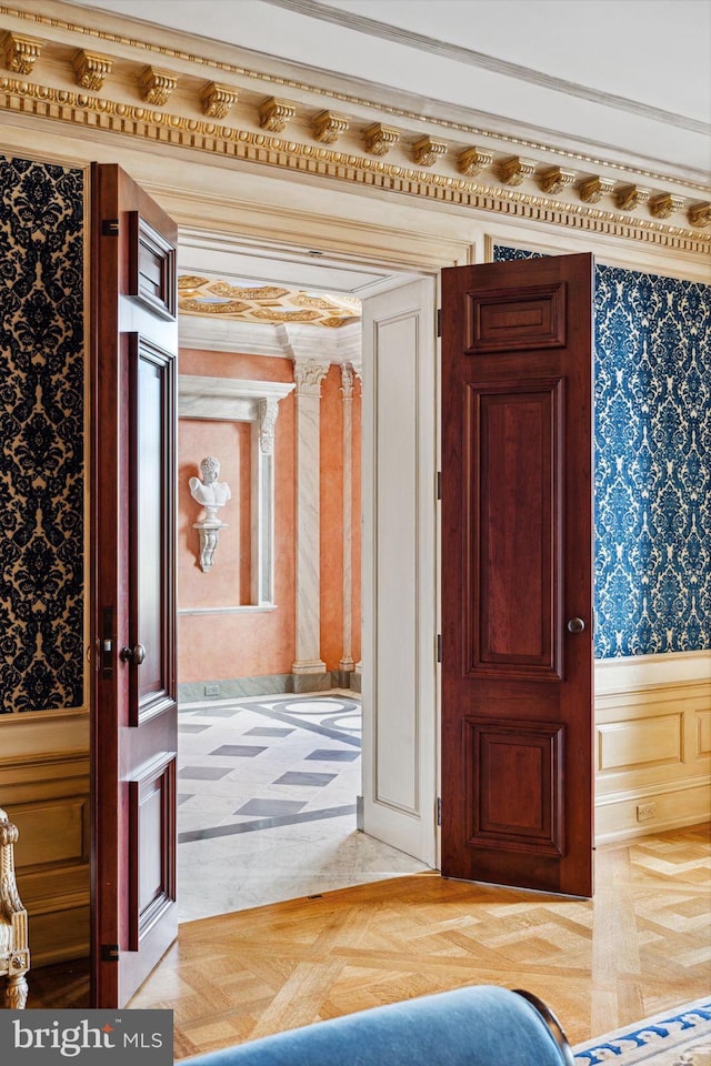 interior space featuring parquet floors and ornamental molding