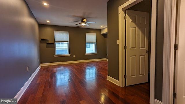 interior space with ceiling fan and dark wood-type flooring