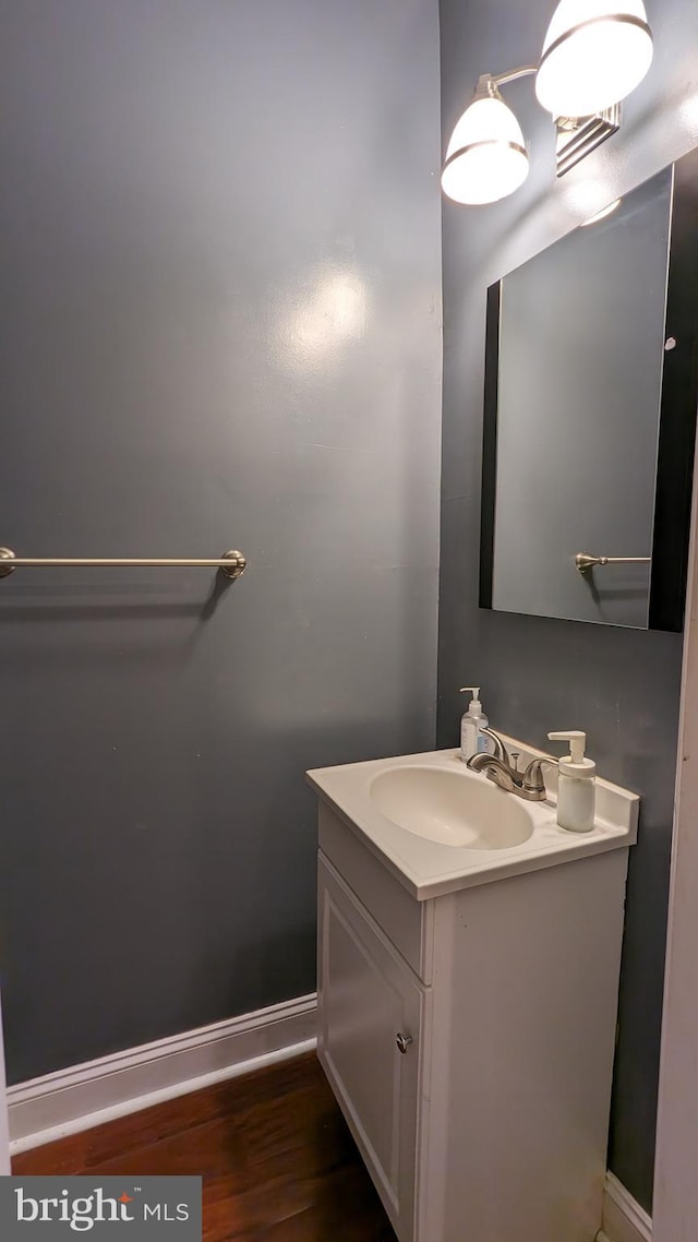 bathroom with vanity and hardwood / wood-style flooring