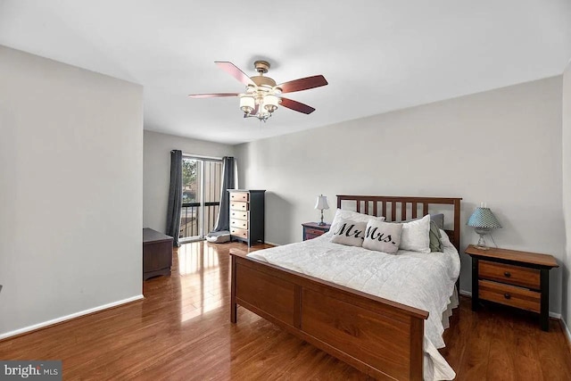 bedroom featuring ceiling fan and dark wood-type flooring