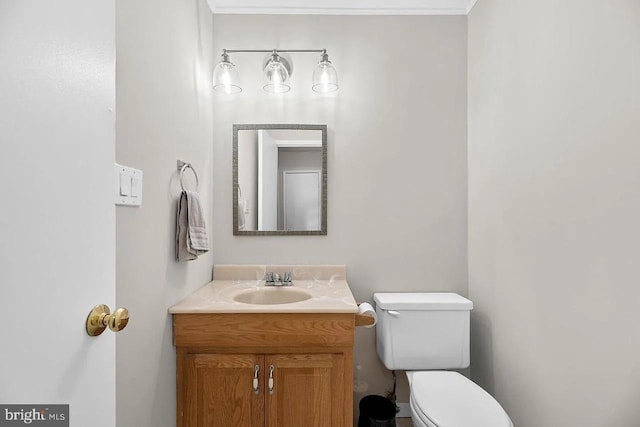 bathroom with toilet and vanity