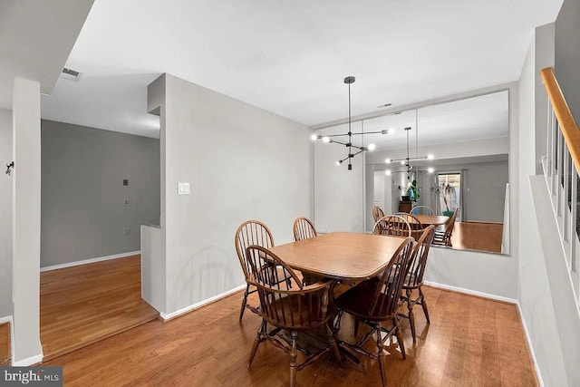 dining space featuring hardwood / wood-style floors