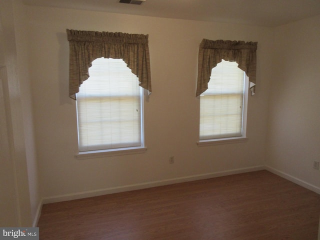 empty room featuring hardwood / wood-style floors