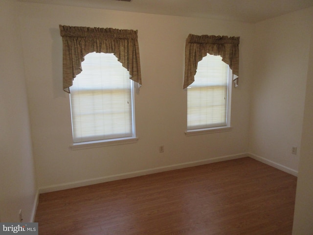 unfurnished room featuring wood-type flooring