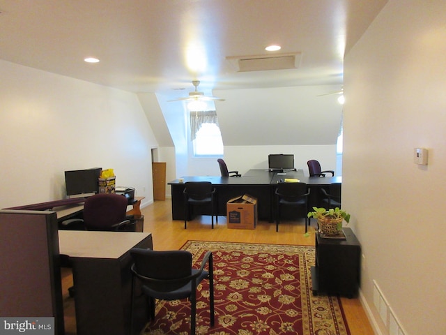 office space with light wood-type flooring and vaulted ceiling