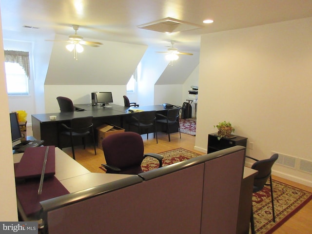 office area with ceiling fan, light wood-type flooring, and vaulted ceiling