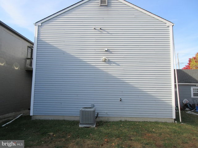 view of property exterior with central AC unit