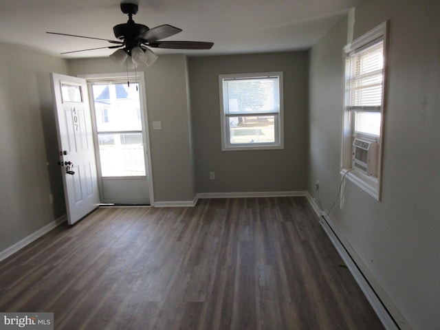 interior space with ceiling fan, plenty of natural light, a baseboard radiator, and dark hardwood / wood-style floors