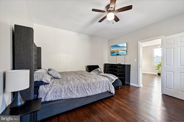 bedroom featuring ceiling fan and dark wood-type flooring