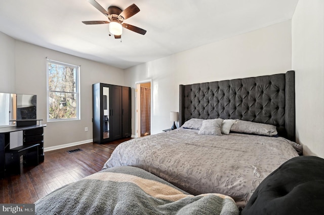 bedroom featuring dark hardwood / wood-style floors and ceiling fan