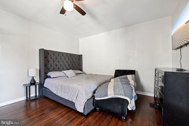 bedroom with ceiling fan and dark wood-type flooring