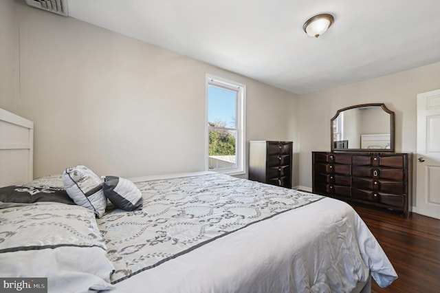 bedroom featuring dark wood-type flooring