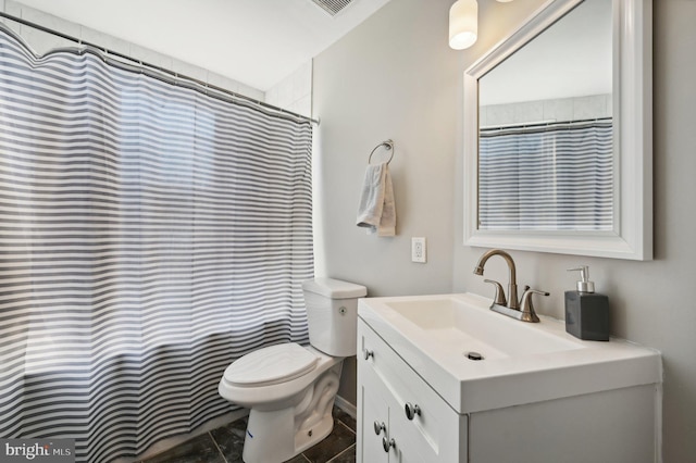 bathroom with tile patterned floors, vanity, toilet, and a shower with curtain