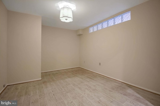 unfurnished room with light hardwood / wood-style floors