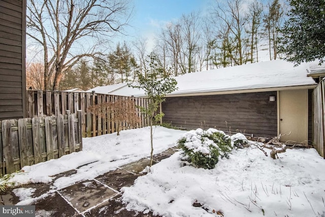 view of yard layered in snow