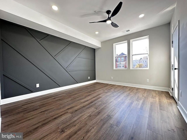 empty room with hardwood / wood-style flooring and ceiling fan