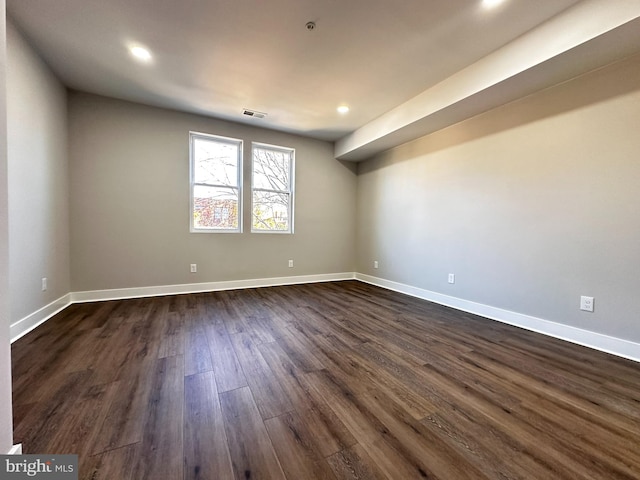 unfurnished room with dark hardwood / wood-style floors