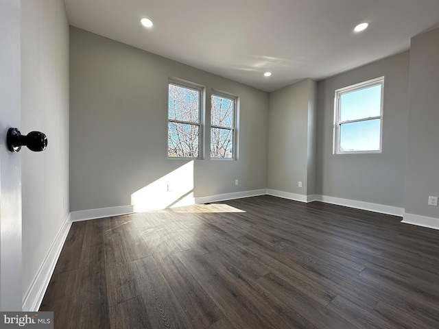 empty room featuring dark hardwood / wood-style floors