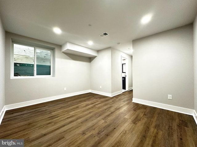 basement featuring dark hardwood / wood-style floors