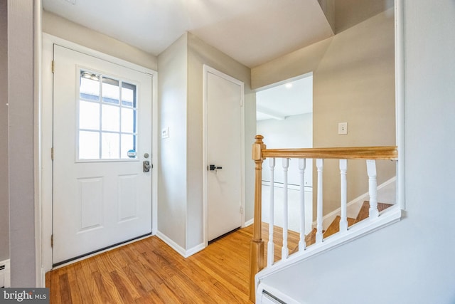 foyer entrance with light hardwood / wood-style floors