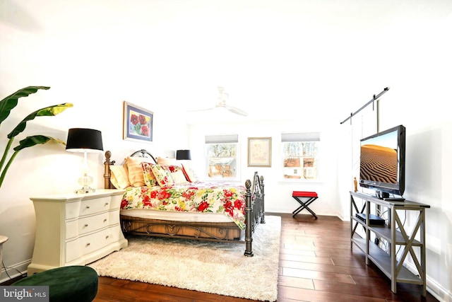 bedroom featuring dark hardwood / wood-style floors and ceiling fan