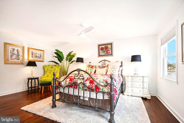 bedroom featuring ceiling fan and dark hardwood / wood-style flooring