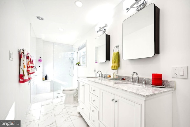 bathroom with vanity, toilet, and an enclosed shower