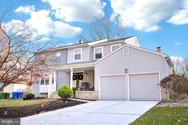 view of front property featuring a porch and a garage