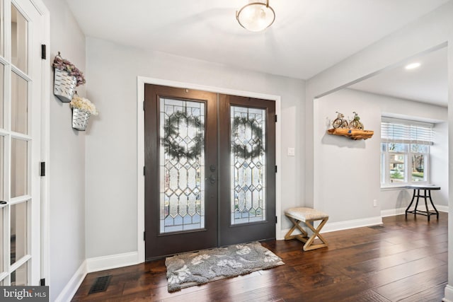 foyer entrance featuring dark wood-type flooring and french doors