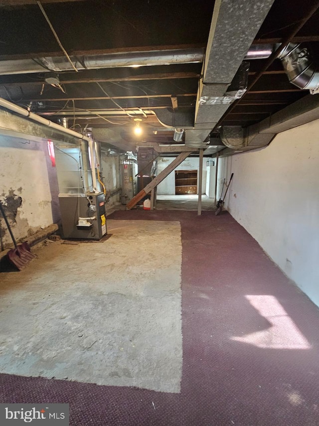 basement with heating unit and water heater