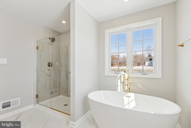 bathroom featuring plus walk in shower