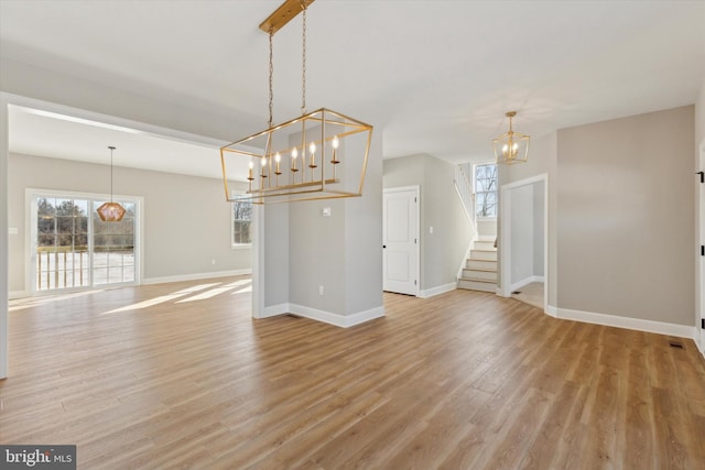 interior space featuring light wood-type flooring and a wealth of natural light