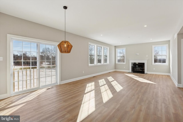 unfurnished living room with light hardwood / wood-style floors