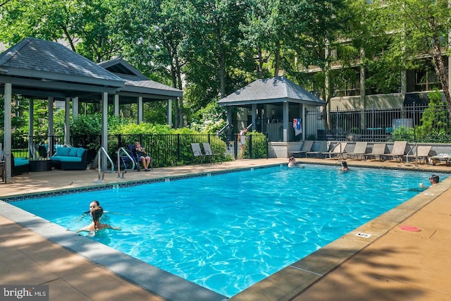 view of pool with a patio area and a gazebo