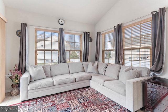 tiled living room with vaulted ceiling