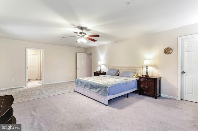 bedroom featuring ceiling fan and light carpet