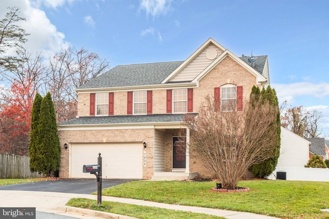 front of property with central AC, a garage, and a front lawn