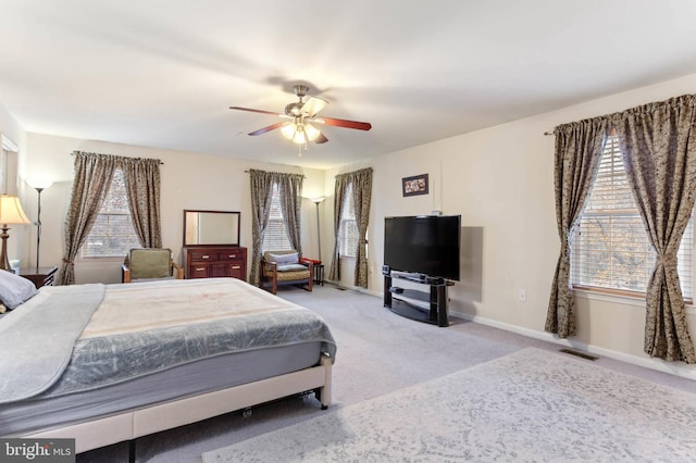 carpeted bedroom featuring ceiling fan