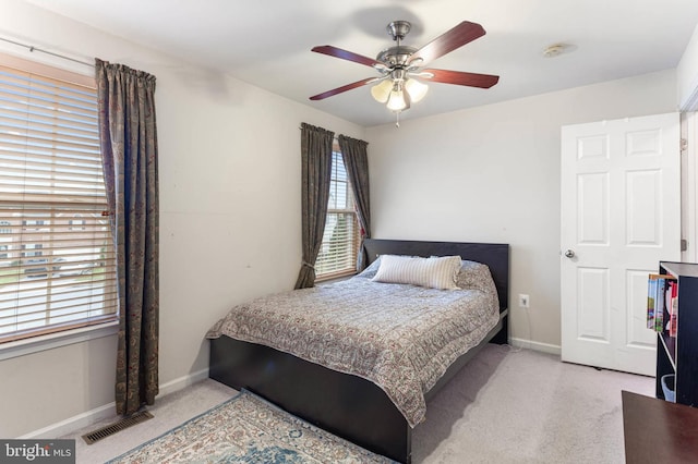 bedroom featuring ceiling fan and light colored carpet