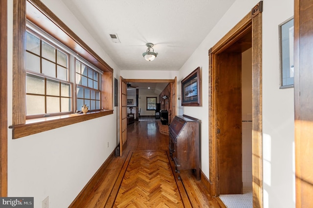 hall featuring parquet floors