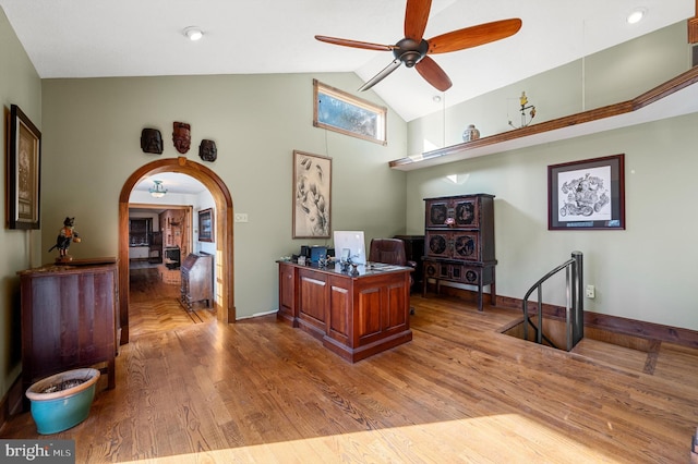 office area featuring ceiling fan, light hardwood / wood-style floors, and lofted ceiling