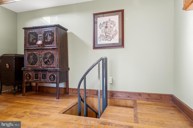 stairway featuring hardwood / wood-style floors